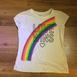 We are selling this rainbow love wins graphic tee!
